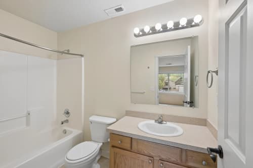 Roberts Court full bathroom with tub shower and vanity