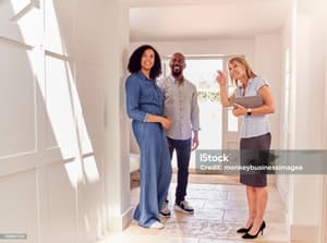 Leasing agent showing a townhome to prospective renters