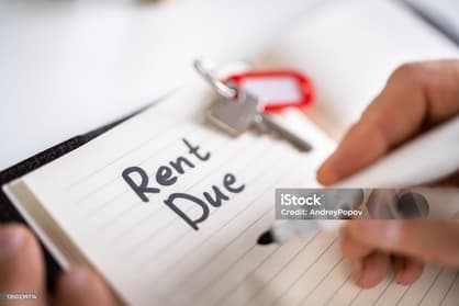 Person making an online rent payment on a laptop
