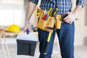 Maintenance technician with tools ready for repairs