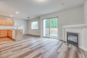 Roberts Court 3-bedroom townhome living room, kitchen, and gas fireplace