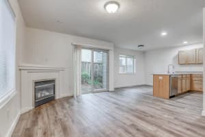 Roberts Court 3-bedroom townhome living area with fireplace and kitchen
